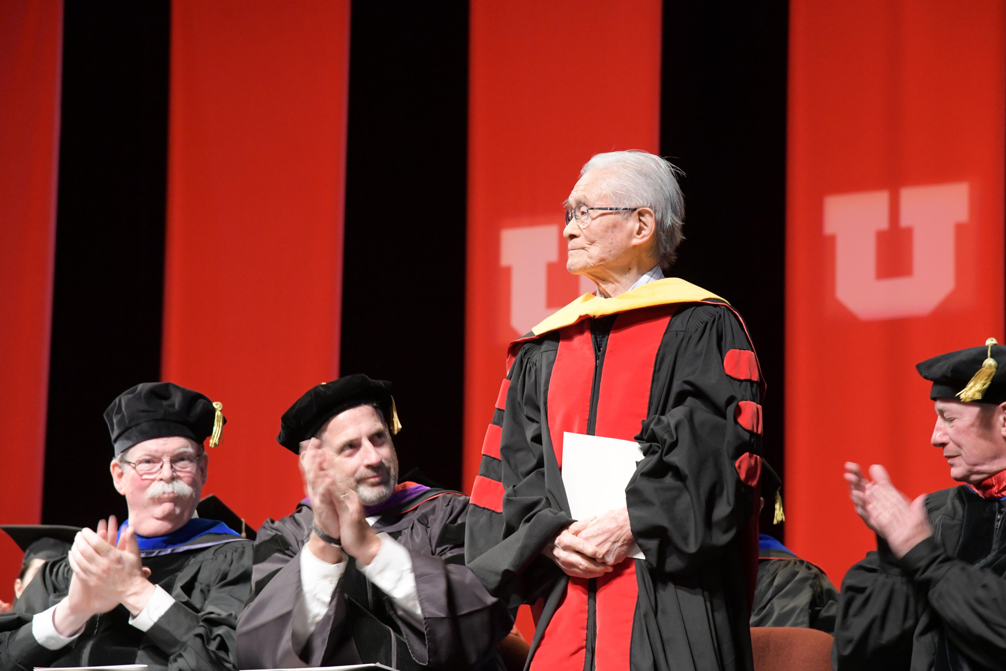 Dr. William "Bill" Higuchi receives numerous applause after being recognized for his honorary doctorate and guest of honor selection at the College of Pharmacy's 2023 Convocation ceremony. (May 12th, 2023)